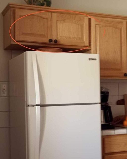 Most folks get this wrong. Here’s what the cupboards above your fridge are for